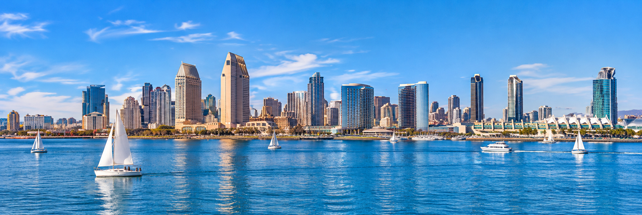 Sunny San Diego skyline and blue bay with sailboats, selected by the Founder.